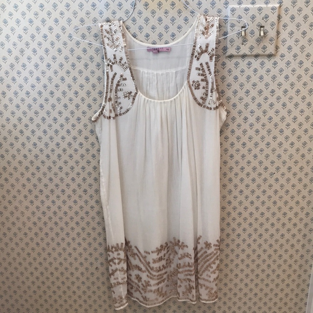 Calypso St. Barth’s white dress with gold beading